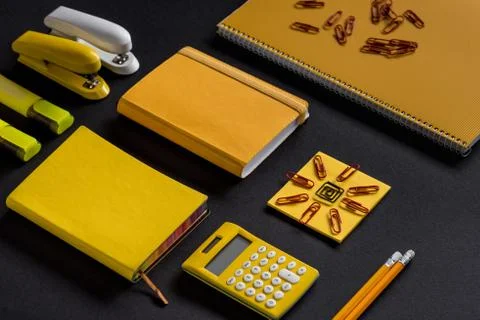 Creative isometric composition of yellow school supplies Stock Photos