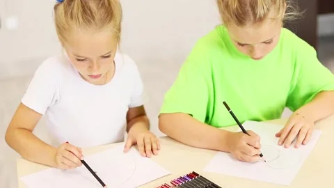 Creative kids express imagination through art in vibrant classroom setting Stock Footage 296332299