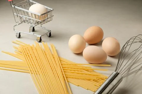 Creative kitchen setup with eggs and pasta for delicious recipes Stock Photos
