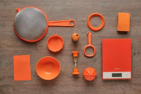 Creative kitchen utensils, nice combination of wood colors and bright orange  Stock Photos