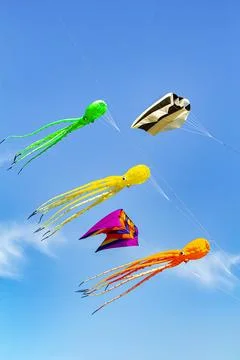 Creative kites of various colors flying Stock Photos