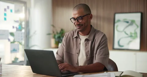 Creative, laptop and man with glasses, office and research for ad campaign on Stock Footage 329395188