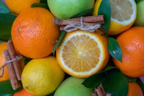 Creative layout of apples, orange, lemon, cinnamon sticks. Flat layout. The Stock Photos