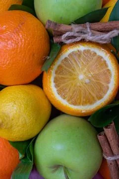 Creative layout of apples, orange, lemon, cinnamon sticks. Flat layout. The Stock Photos