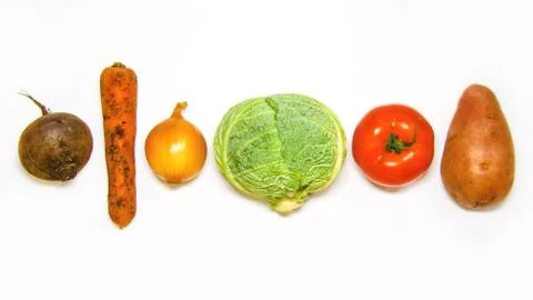 Creative layout of cabbage, onions, tomatoes, potatoes, carrots, beets. The c Stock Photos