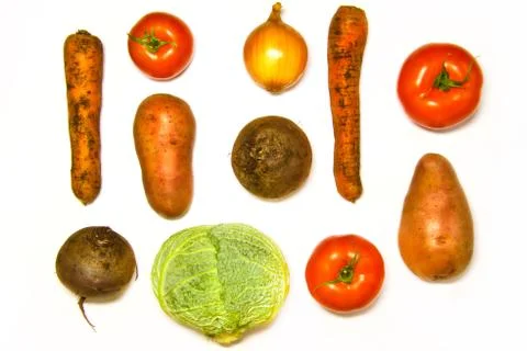 Creative layout of cabbage, onions, tomatoes, potatoes, carrots, beets. The c Stock Photos