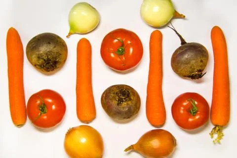 Creative layout of cabbage, onions, tomatoes, potatoes, carrots, beets. The c Stock Photos