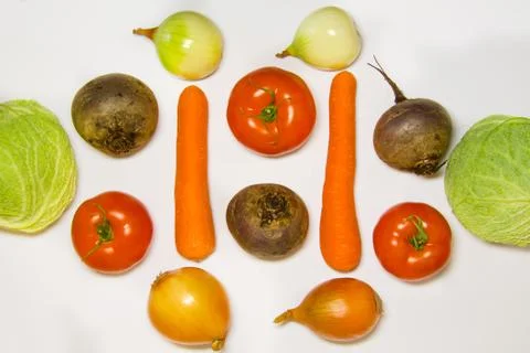 Creative layout of cabbage, onions, tomatoes, potatoes, carrots, beets. The c Stock Photos