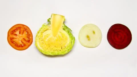Creative layout of chopped cabbage, tomato, beet onion. The concept of useful Stock Photos