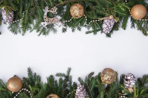 Creative layout of Christmas tree branches with cones, space for text. Concep Stock Photos