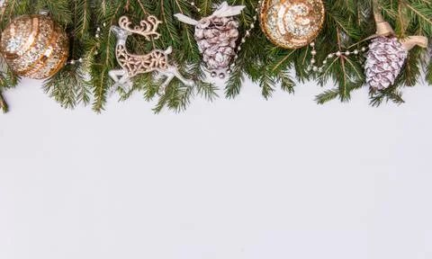 Creative layout of Christmas tree branches with cones, space for text. Concep Stock Photos