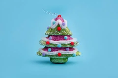 Creative layout with a Christmas tree on a bright blue background. Minimal wi Stock Photos