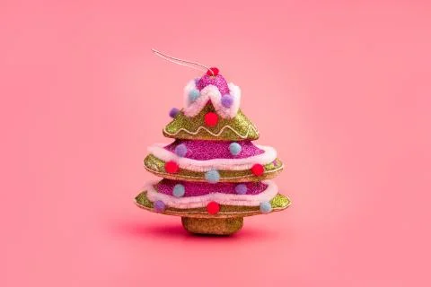 Creative layout with a Christmas tree on a bright Pink background. Minimal wi Stock Photos