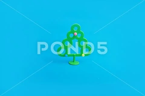 Creative layout with a Christmas tree on a bright blue background. Minimal wi Stock Photos