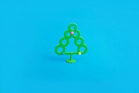 Creative layout with a Christmas tree on a bright blue background. Minimal wi Stock Photos