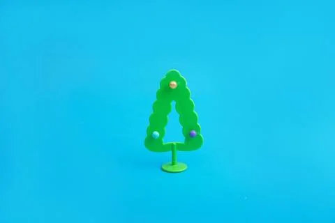Creative layout with a Christmas tree on a bright blue background. Minimal wi Stock Photos