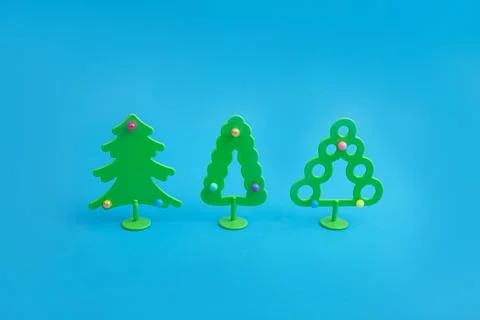 Creative layout with a Christmas trees on a bright blue background. Minimal w Stock Photos