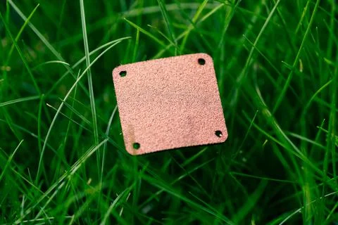 Creative layout composition frame made of green grass lawn with square brown Stock Photos