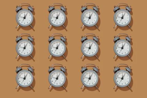Creative layout of gray alarm clock's Stock Photos