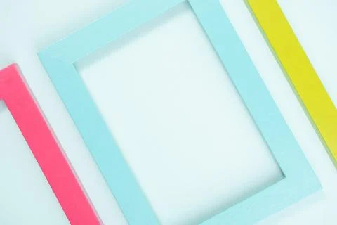 Creative layout made of bright colored frames on blue background. Flat lay To Stock Photos