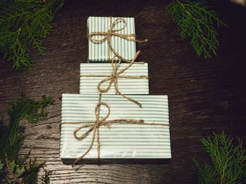 Creative layout made of Christmas tree branches with gifts. Flat lay. Nature New Foto stock