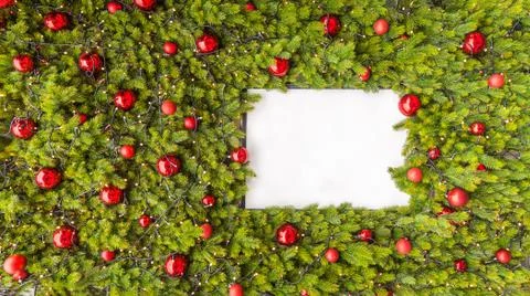 Creative layout made of Christmas tree branches with white paper card note. Flat Stock Photos