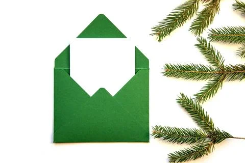 Creative layout made from a Christmas tree branch and a handmade envelope. Place Stock Photos