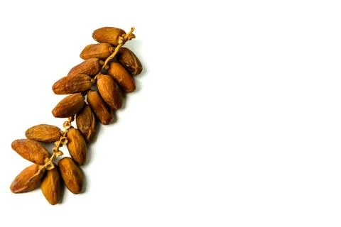 Creative layout made of dried dates isolated on a white background Foto stock