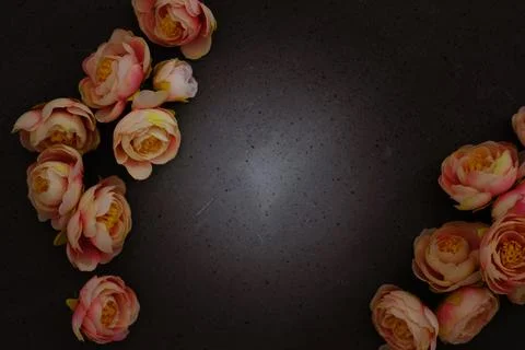 Creative layout made with flowers on dark grey background. Flat lay. Spring Stock Photos