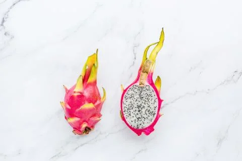 Creative layout made of fresh dragon fruit on white marble background. Tropic Stock Photos