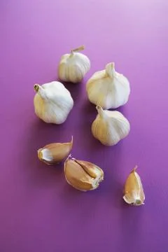 Creative layout made of garlic on the white background. Flat lay. Food concept. Stock Photos