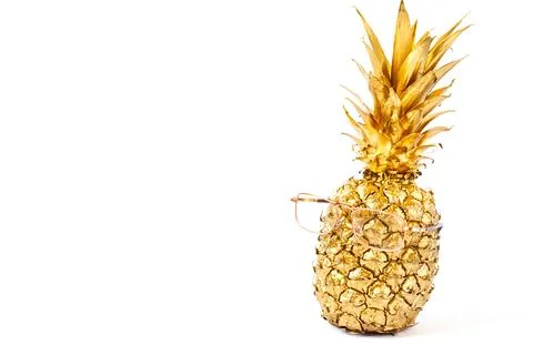 Creative layout made gold pineapple with glasses isolated on white background Stock Photos