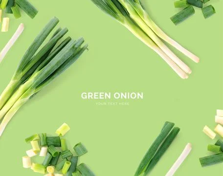 Creative layout made of green onion. Flat lay Stock Photos