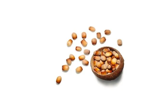 Creative layout made of hazelnut nuts,almond on white background. Fotos Stock