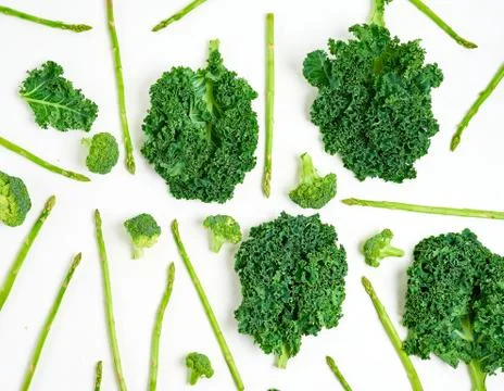 Creative layout made of kale, broccoli, asparagus. Flat lay. Healthy food con Stock Photos