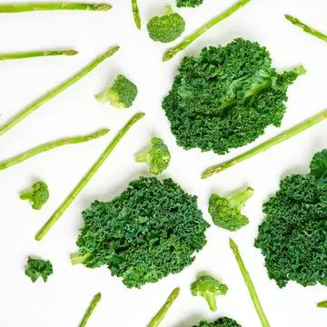 Creative layout made of kale, broccoli, asparagus. Flat lay. Healthy food con Stock Photos