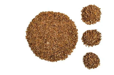 Creative layout made of organic flax seeds isolated on white background. Flat Foto stock
