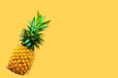Creative layout made of pineapple. Flat lay foods concept on yellow backgroun Stock Photos
