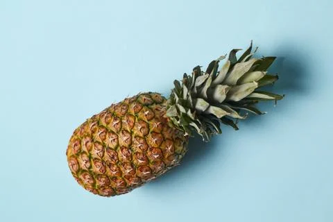 Creative layout made of pineapple isolated on blue. Flat lay. Stockfoto's