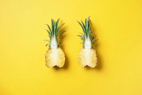 Creative layout made of pineapple on yellow background. Top view. Copy space Stock Photos