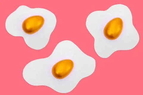 Creative layout made of scrambled eggs with decorated golden Easter eggs on a Stock Photos
