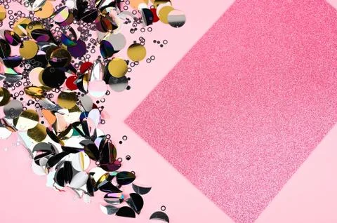 Creative layout made of sequins decor and pink glittr card. A beautiful found Stock Photos
