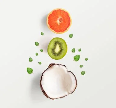 Creative layout made of summer tropical fruits.Coconut, kiwi and grapefruit Foto stock