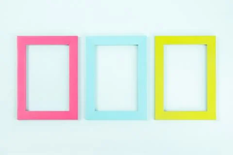 Creative layout made of three bright colored frames on blue background. Flat  Foto stock