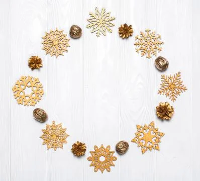 Creative layout of New Year's decorations. Golden snowflakes, fir cones and n Stock Photos