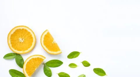 Creative layout orange slices with green leaves on white background, flat l.. Stock Photos