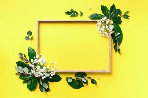 Creative layout with white flowers and copyspace over yellow background. Top Stock Photos
