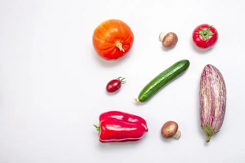 Creative layout of zucchini, bell peppers, sherry tomatoes, tomatoes, cucum.. Stock Photos
