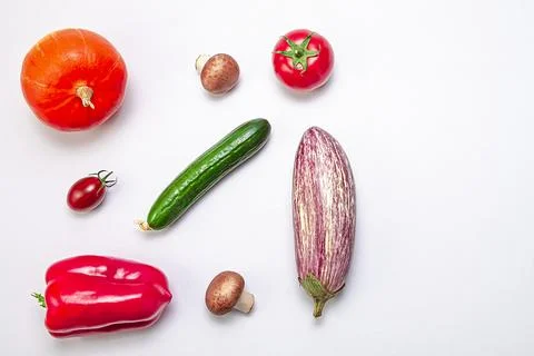 Creative layout of zucchini, bell peppers, sherry tomatoes, tomatoes, cucumbe Stock Photos