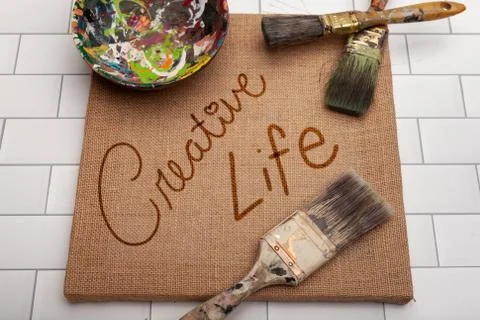 Creative life message on brown square canvas with art brushes Stock Photos